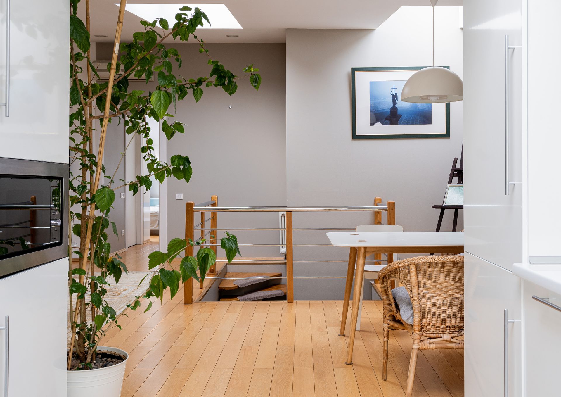 Light oak flooring in a bright open kitchen and dining space